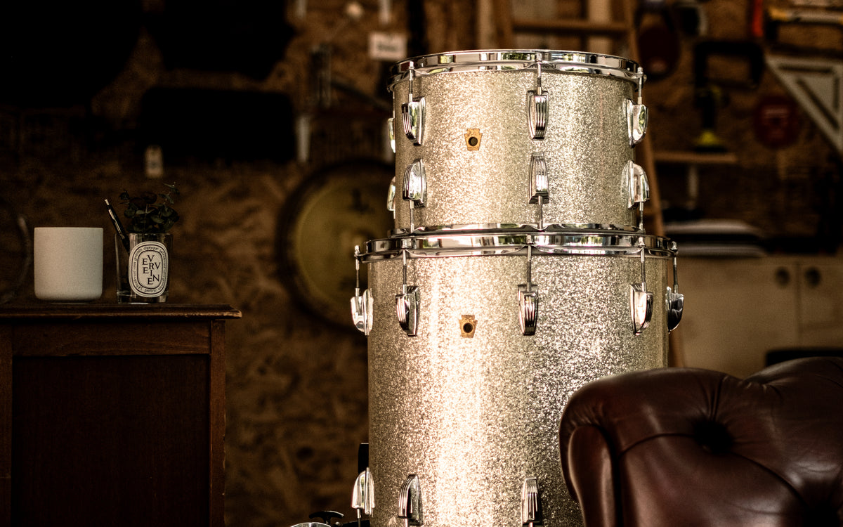 Vintage silver sparkle drum kit in a dark room